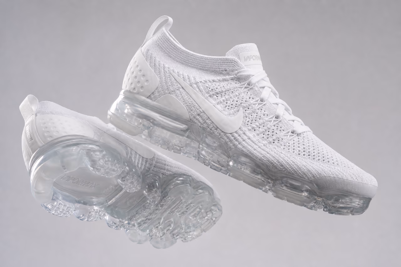Mens White Vapormax Sneakers Floating in Studio Setting