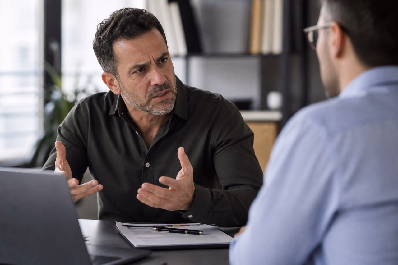 Frustrated Employee Voicing a Complaint to a Colleague
