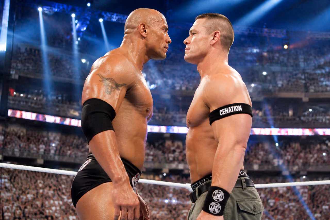 Two Professional Wrestlers Facing Off in a Crowded Stadium Ring